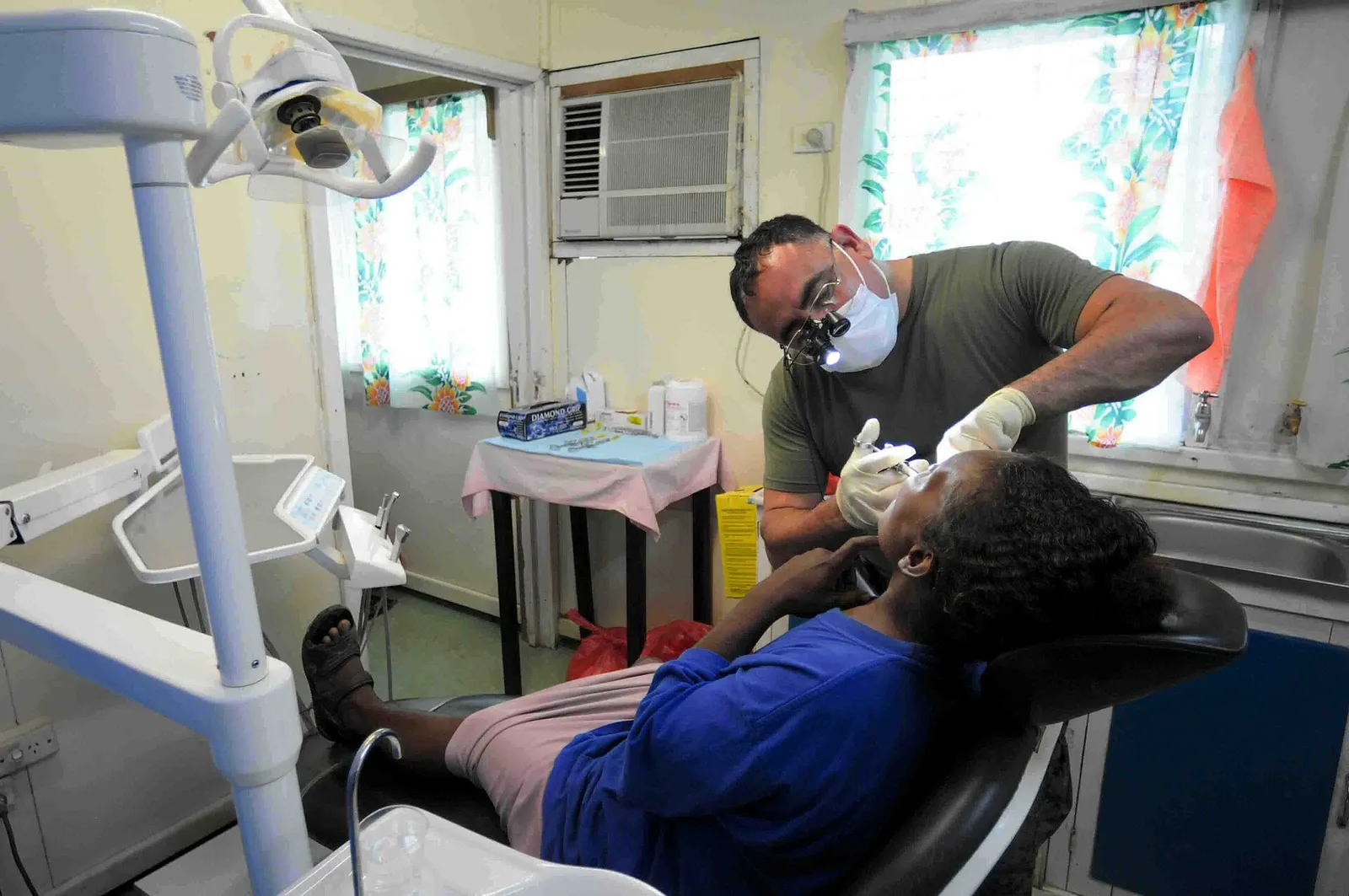 A dentist treating a patient