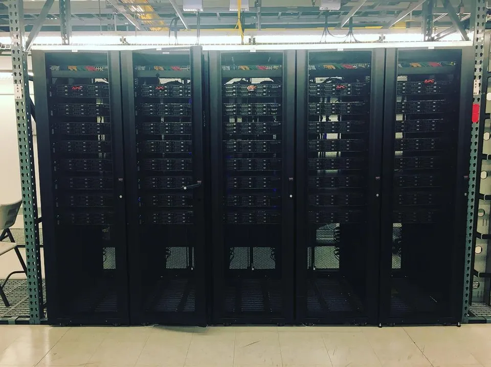 Rows of server racks inside a data center