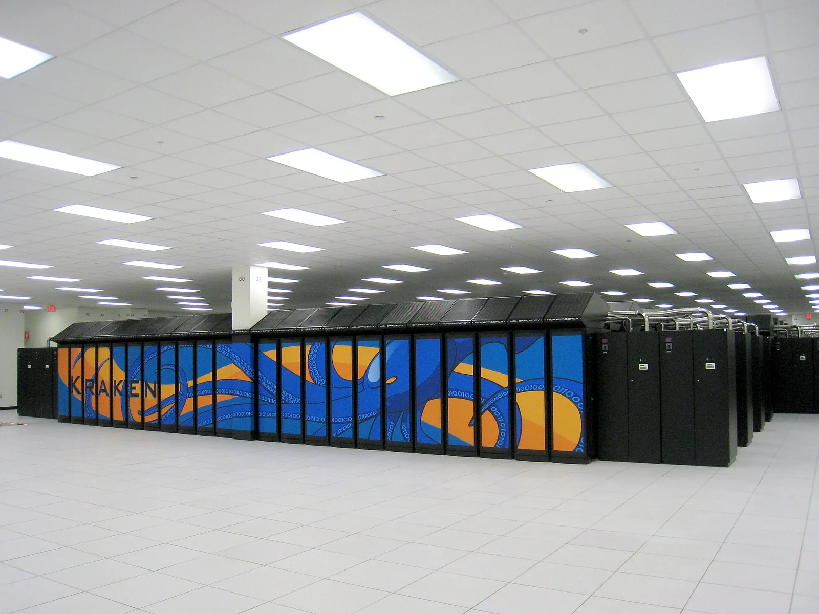 Rows of Cray XT5 supercomputer cabinets in a machine hall at Oak Ridge