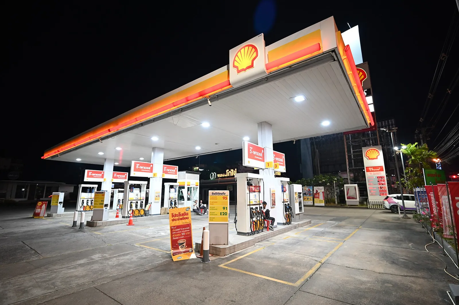 A gas station forecourt at night