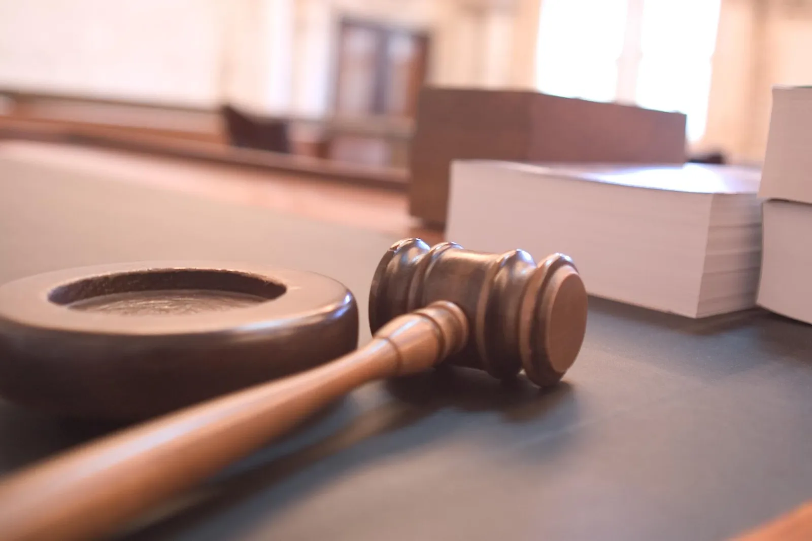 A judge's gavel in a courtroom
