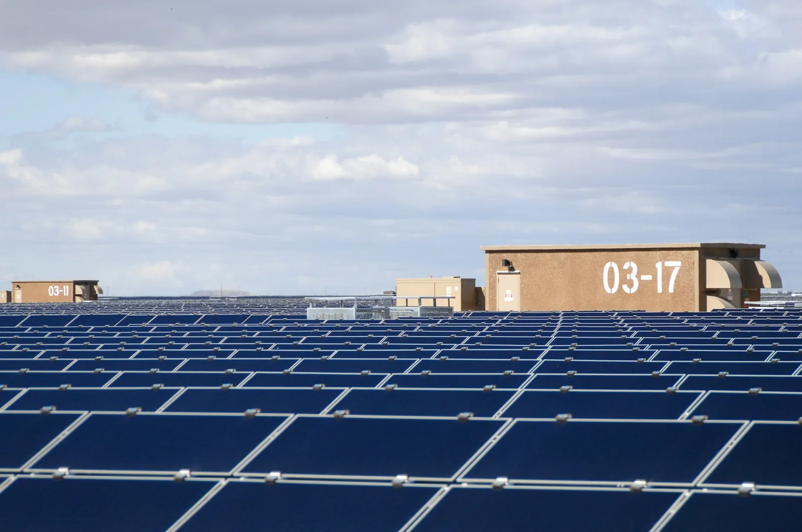Rows of solar panels at a large utility-scale solar installation