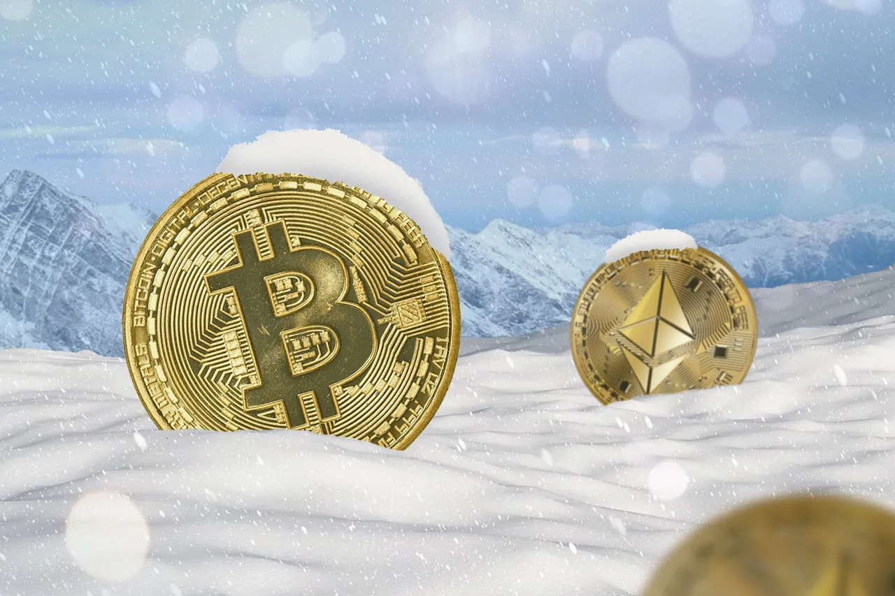Cryptocurrency coins in snow, illustrating a market downturn