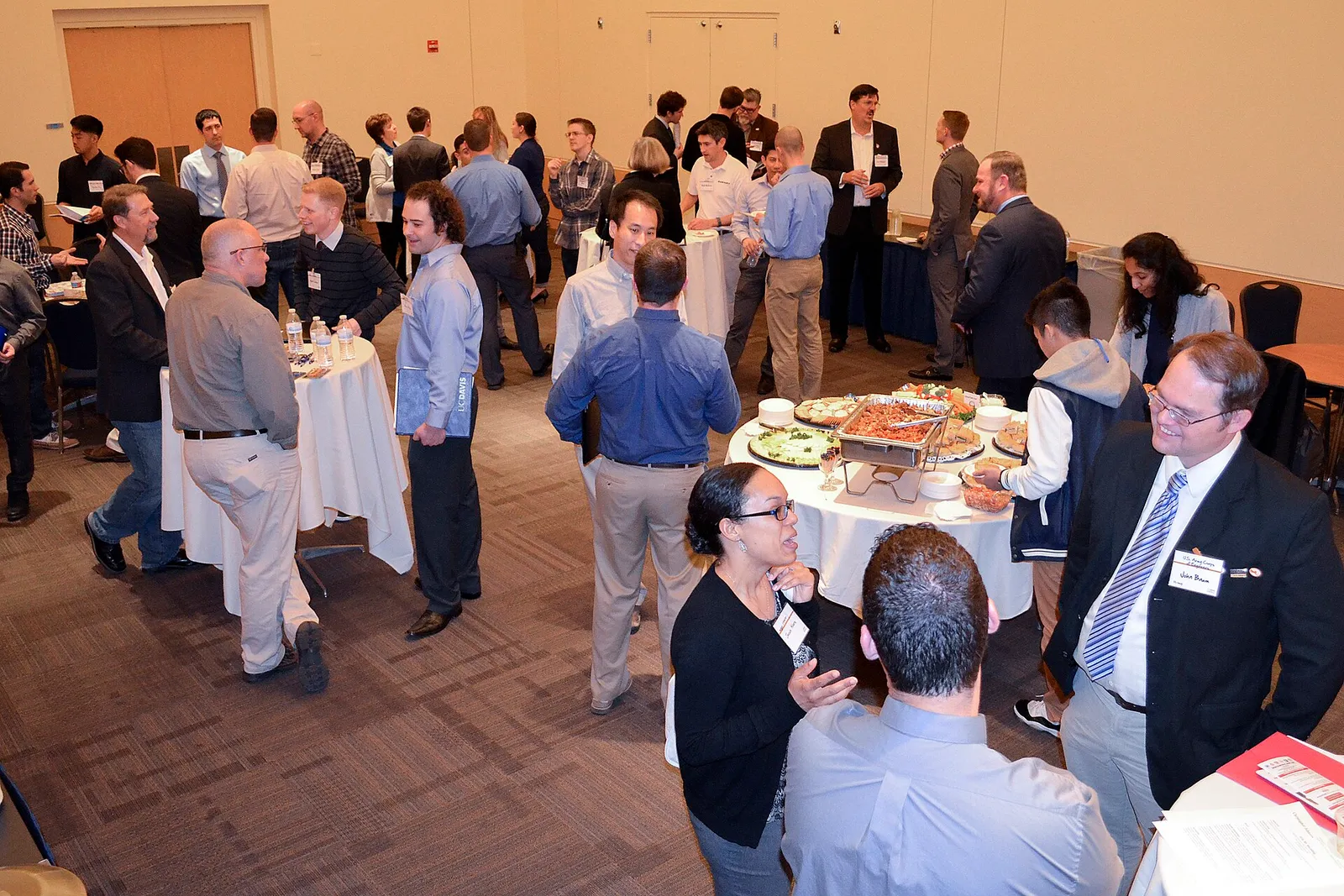 People talking with recruiters at a job fair