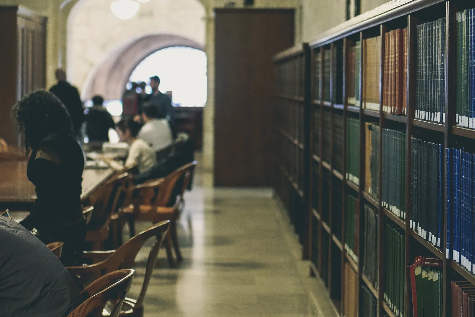 Rows of books on library shelves
