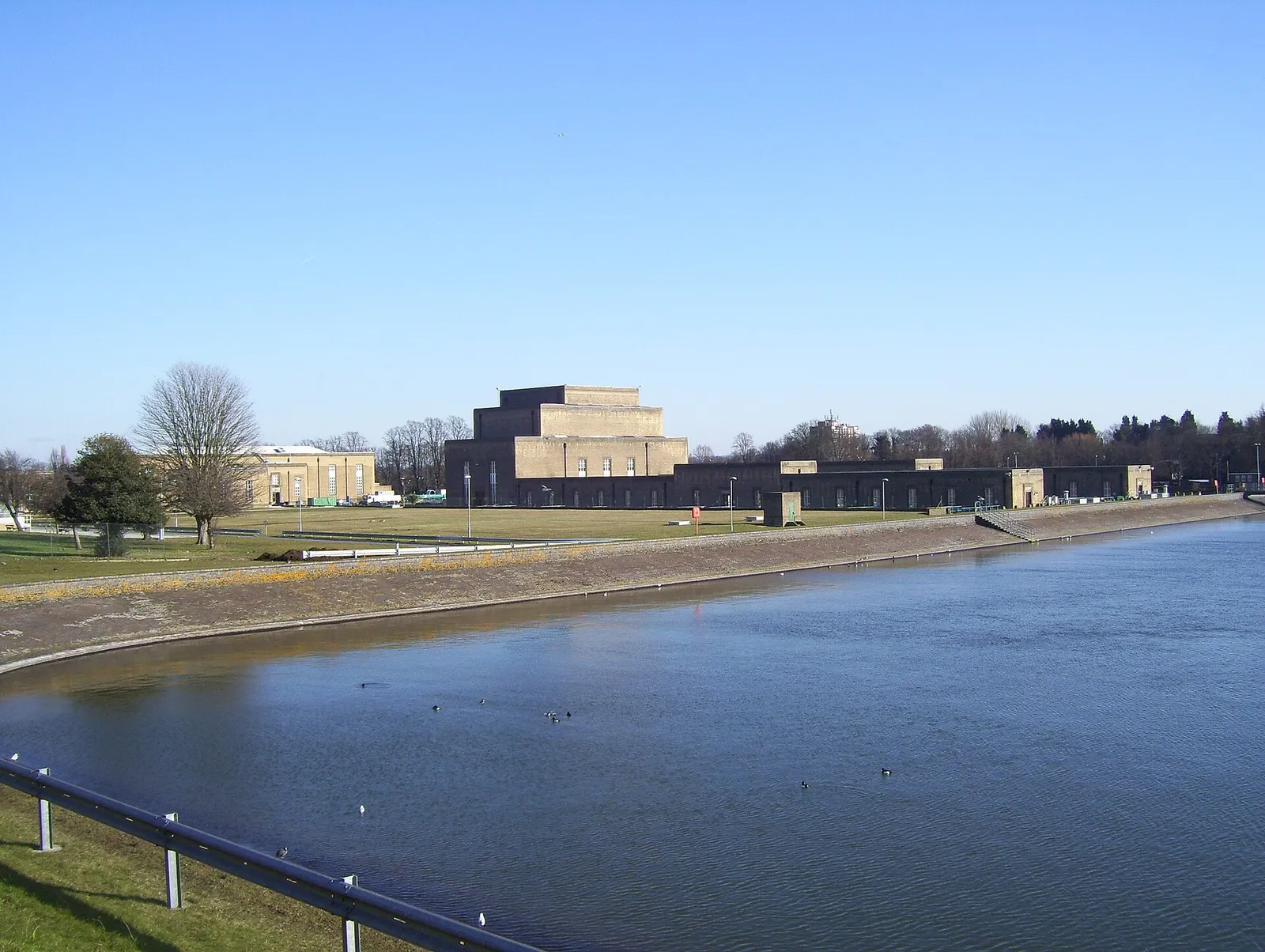 A waterworks building beside a reservoir in England