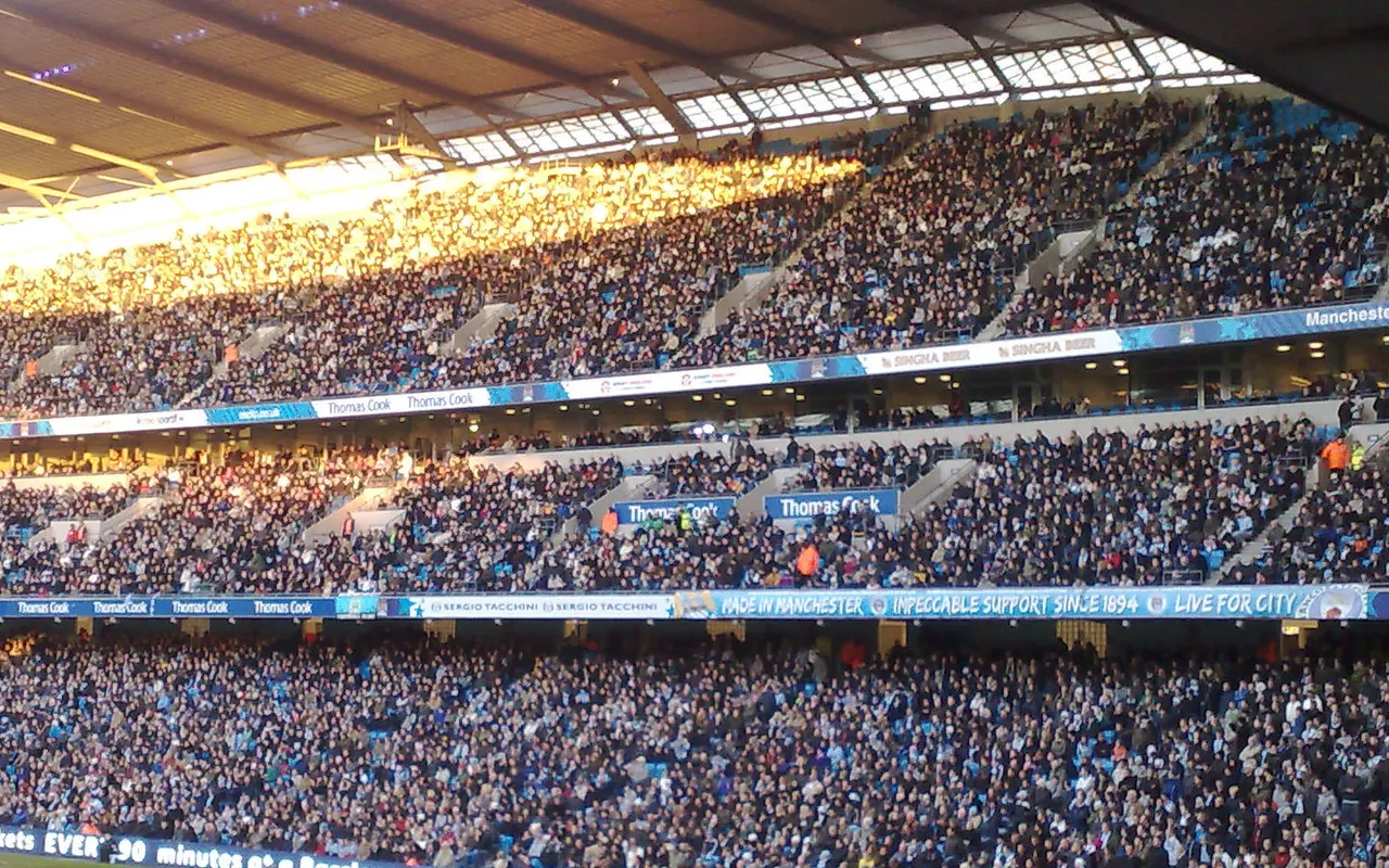 A packed stadium crowd at a football match