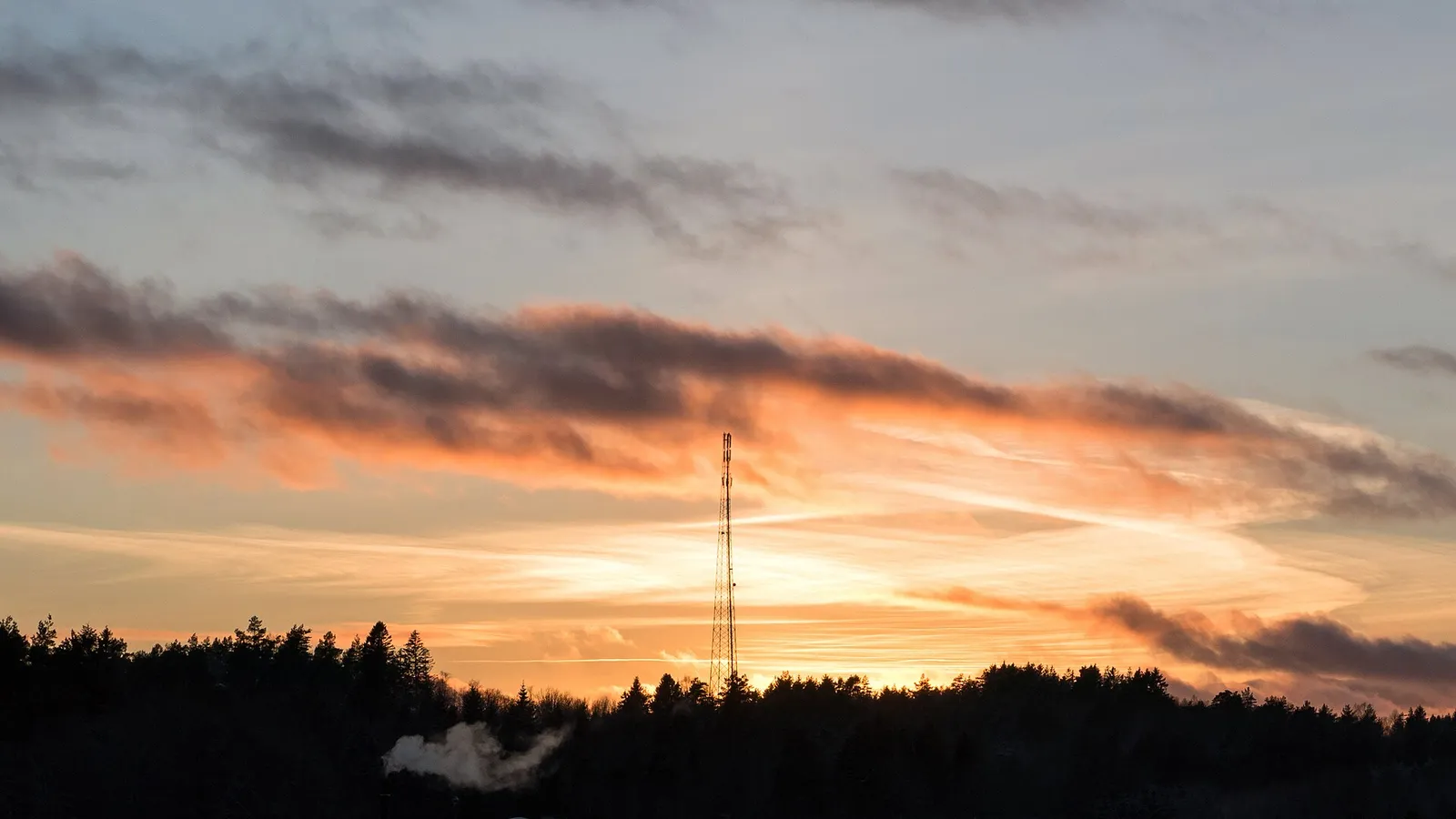 A telecommunications mast at sunset