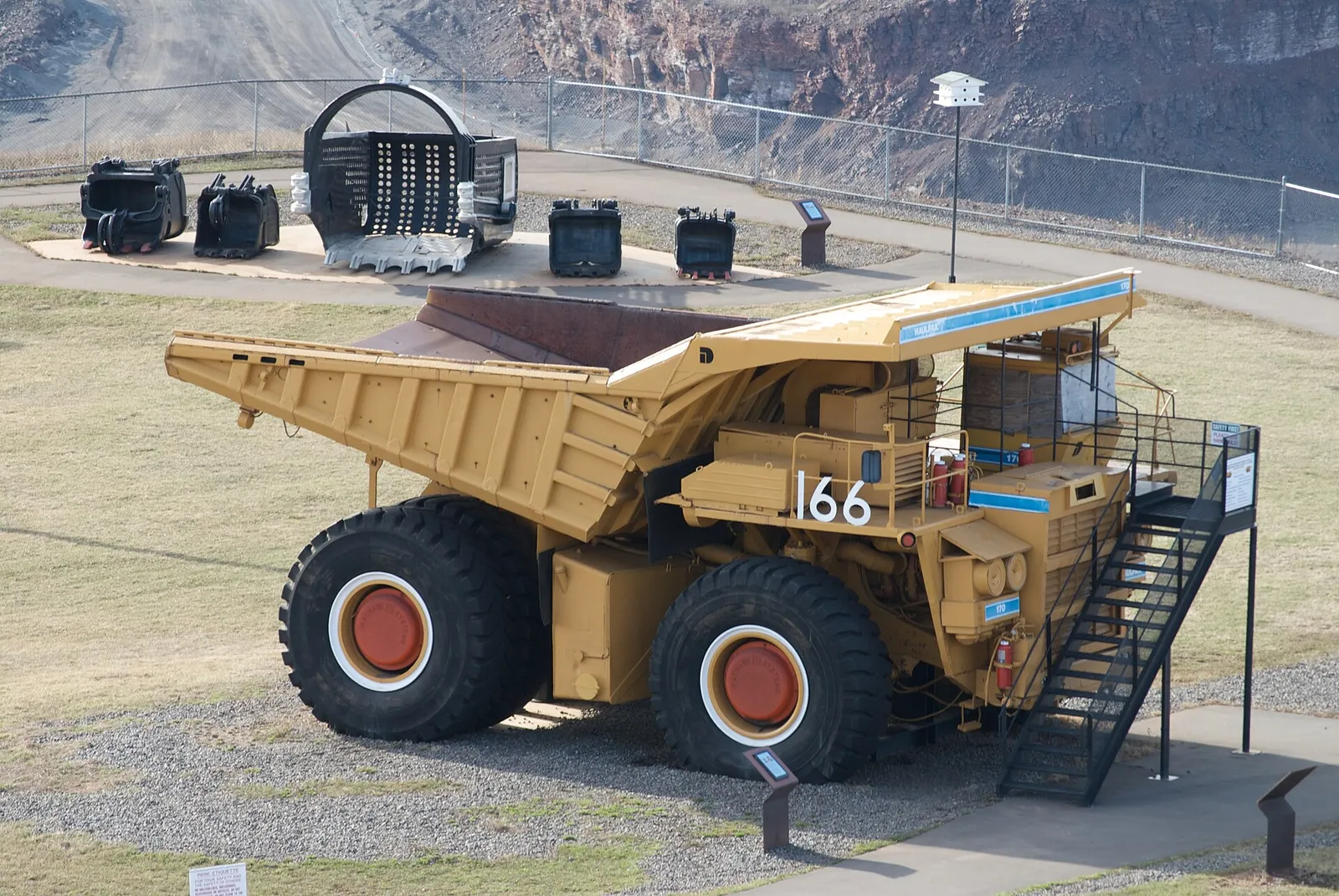 A giant haul truck at an open-pit mine