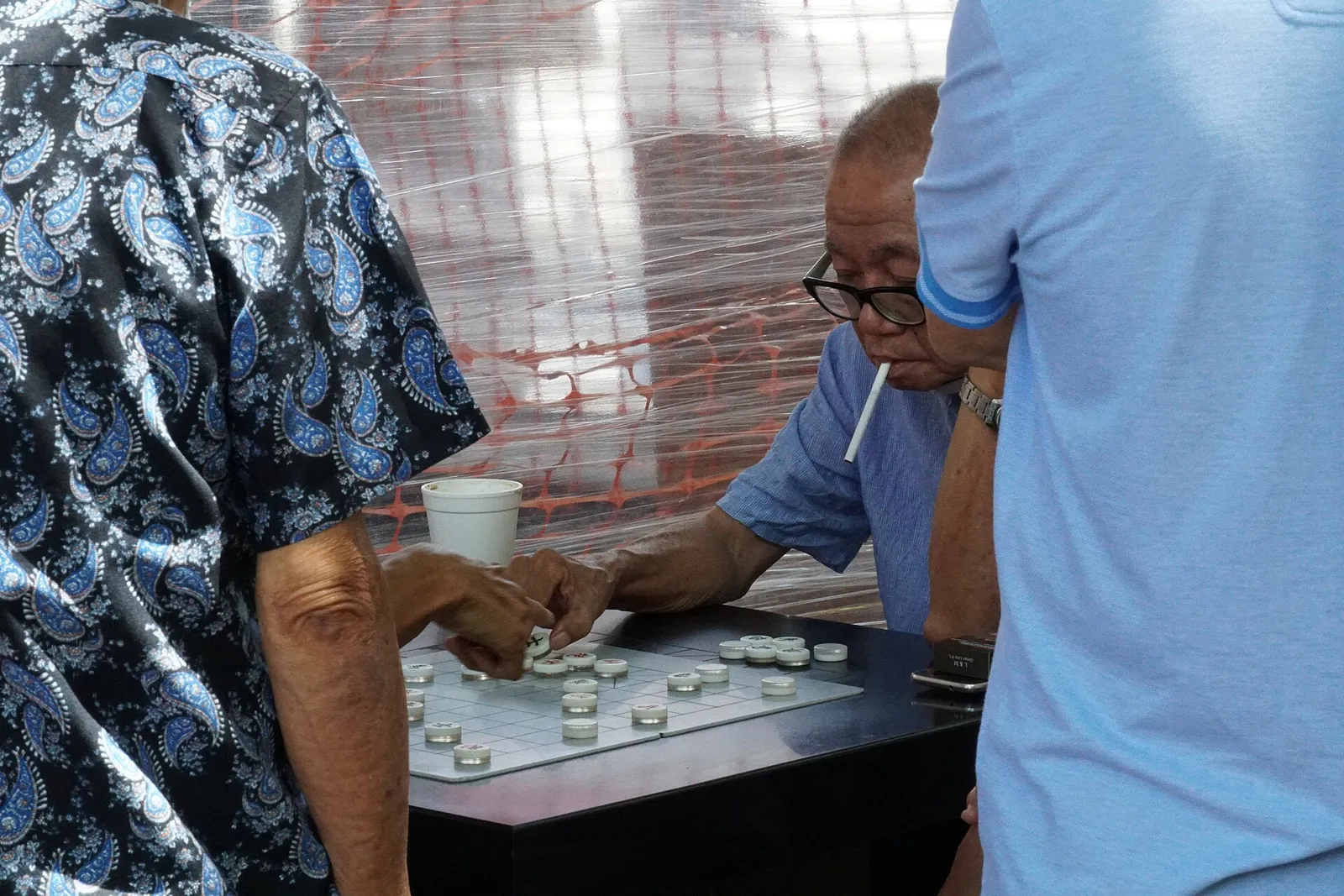 Older people playing chess