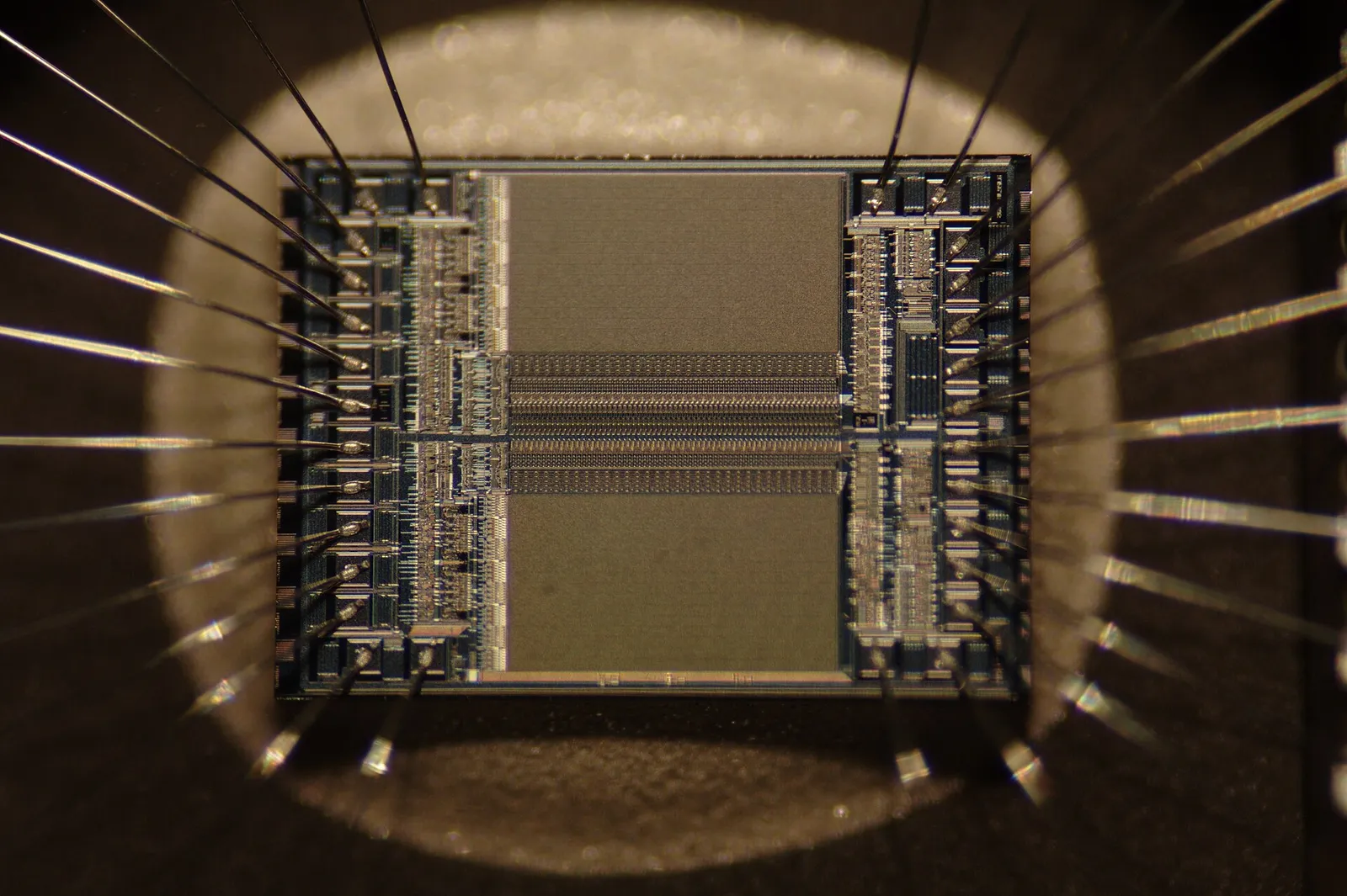 A close-up macro photograph of a semiconductor microchip