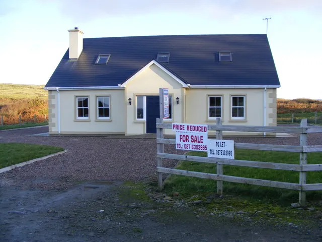 A house-for-sale sign outside a property