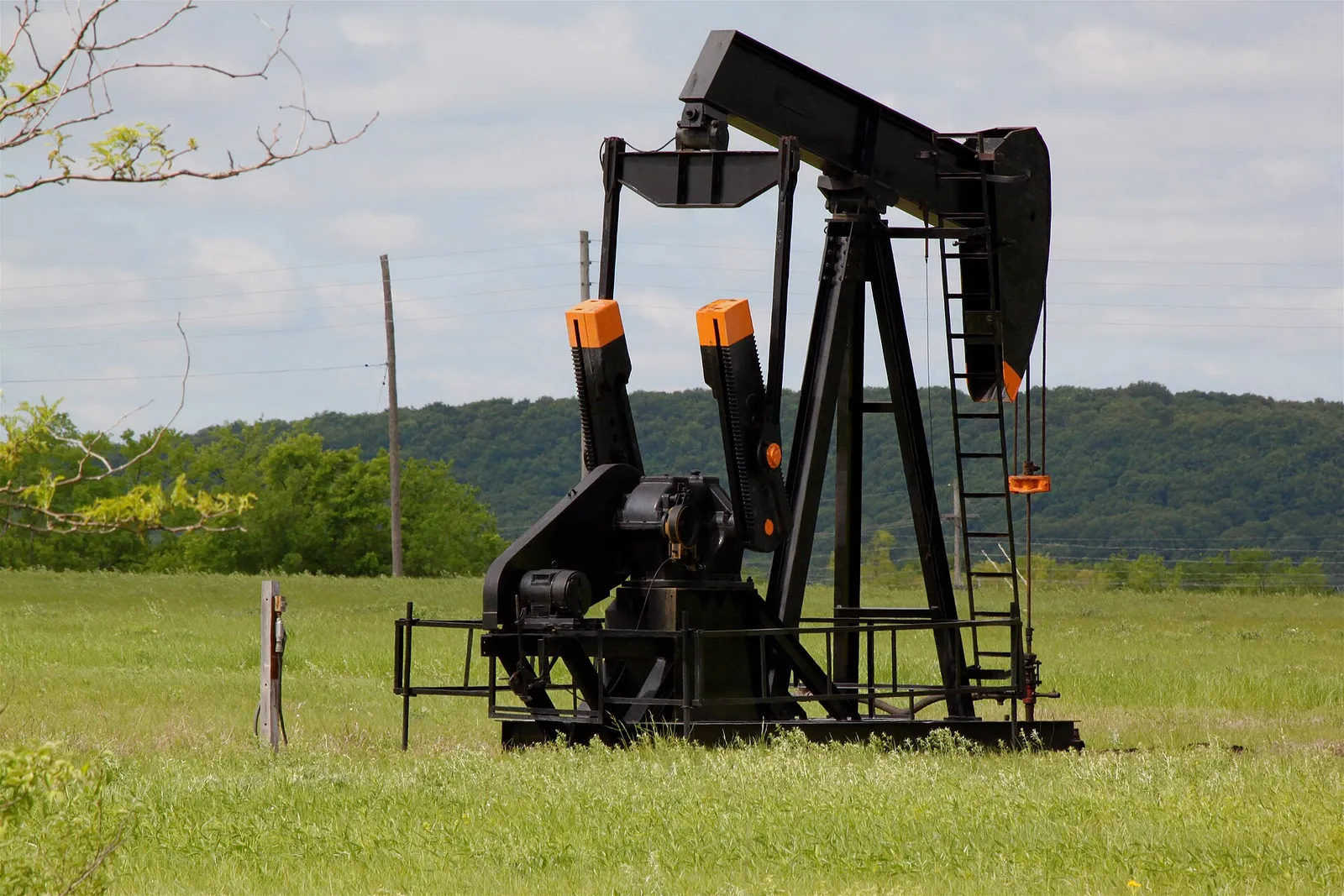 An oil pumpjack in a field