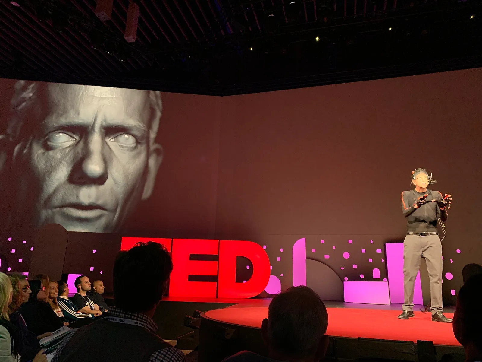 A demonstration of real-time deepfake facial technology on stage
