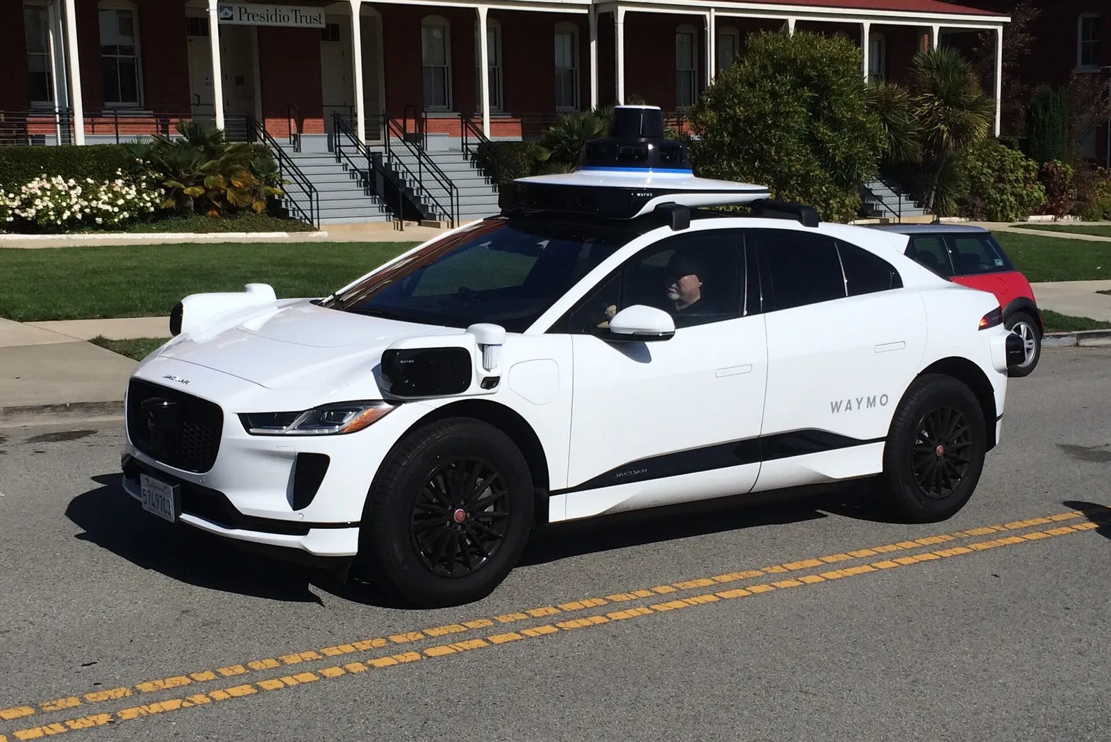 A Waymo Jaguar I-Pace autonomous vehicle on a street in San Francisco