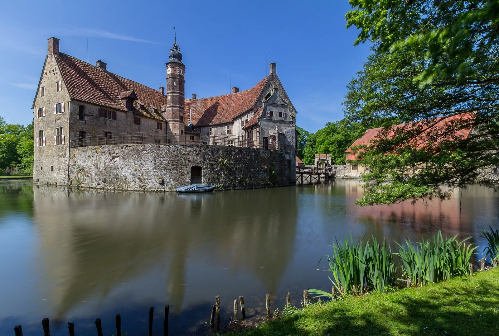 A medieval castle surrounded by a water-filled moat