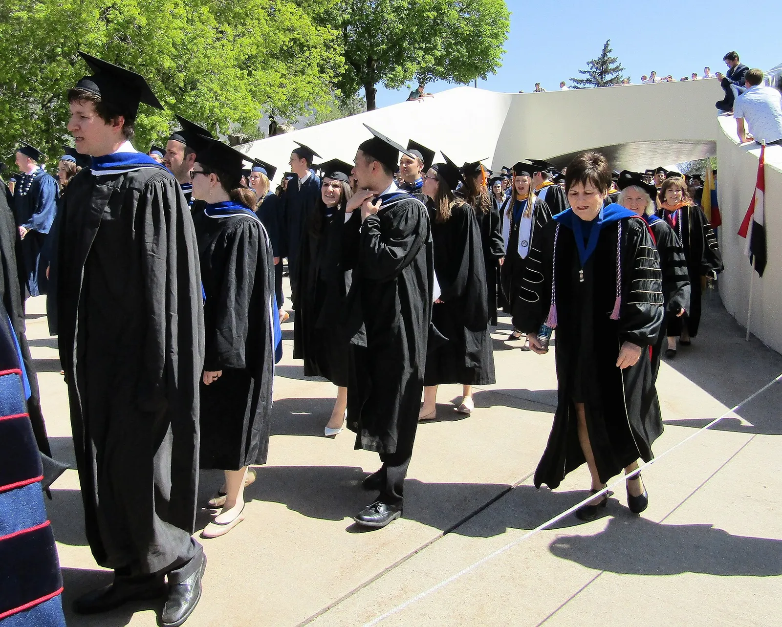Graduates in caps and gowns at a university commencement