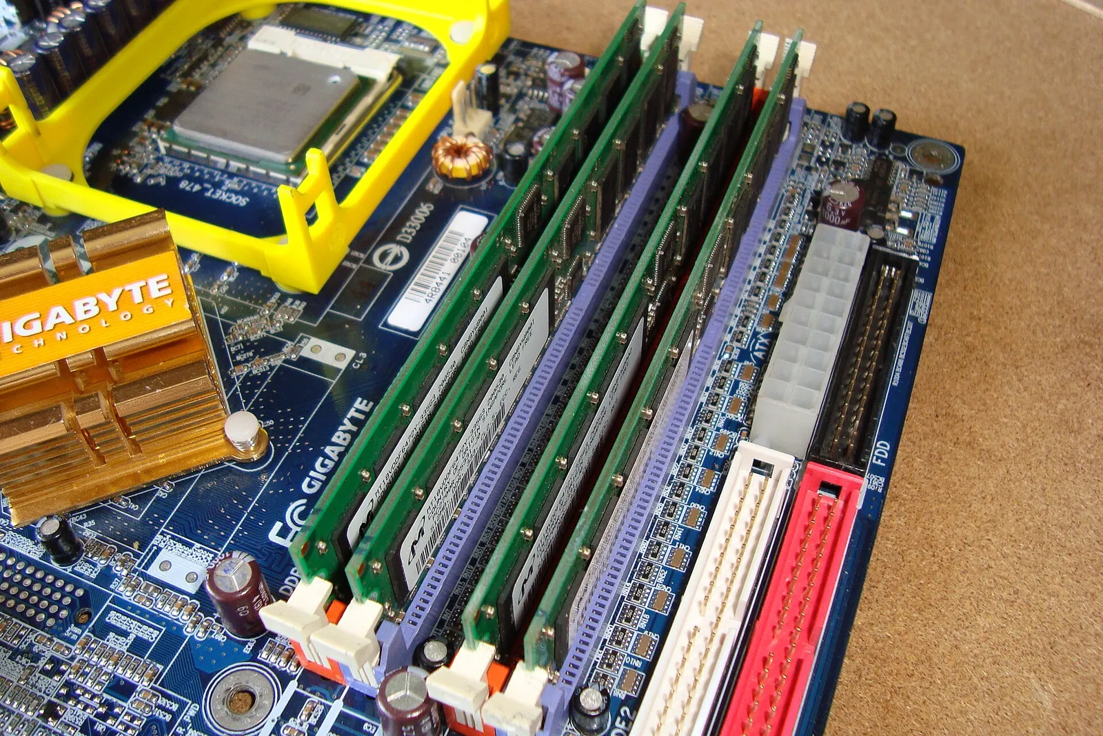 DDR memory modules seated in the slots of a computer motherboard