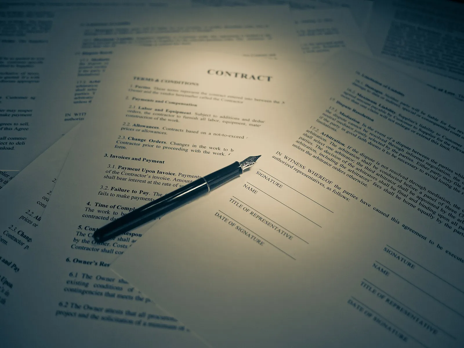 A legal contract and a pen