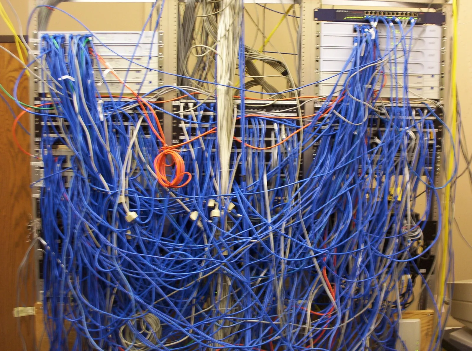 A network cabling closet with patch panels and cables