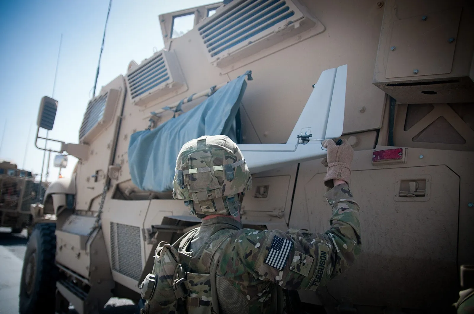 Soldiers launching a small drone