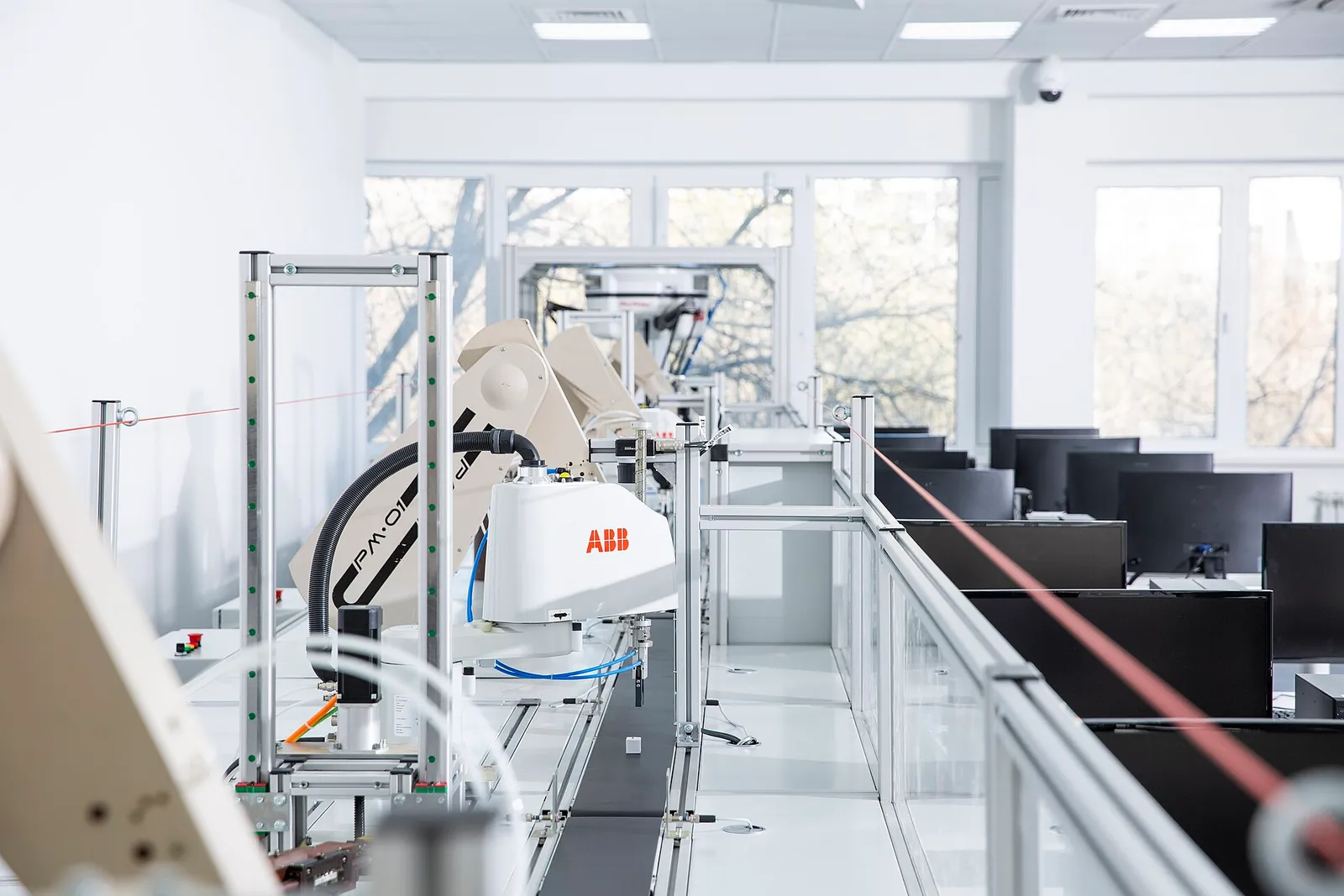Robotic arms on a digital manufacturing line