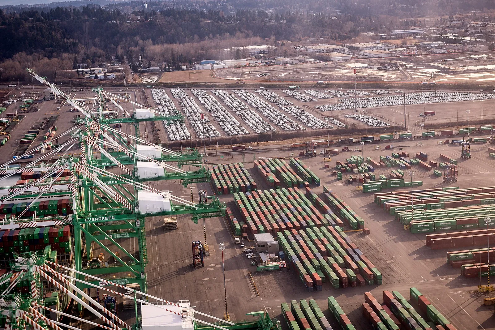 Aerial view of shipping containers and cranes at Tacoma's container port
