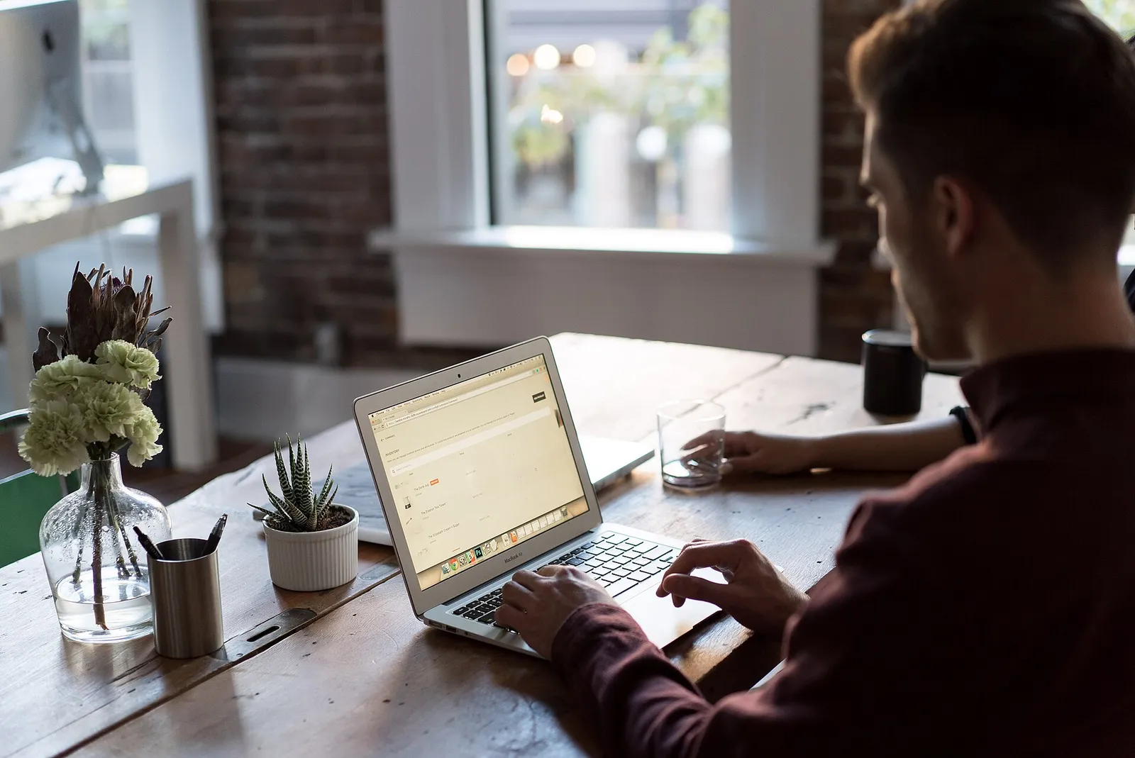A person working at a laptop in an office