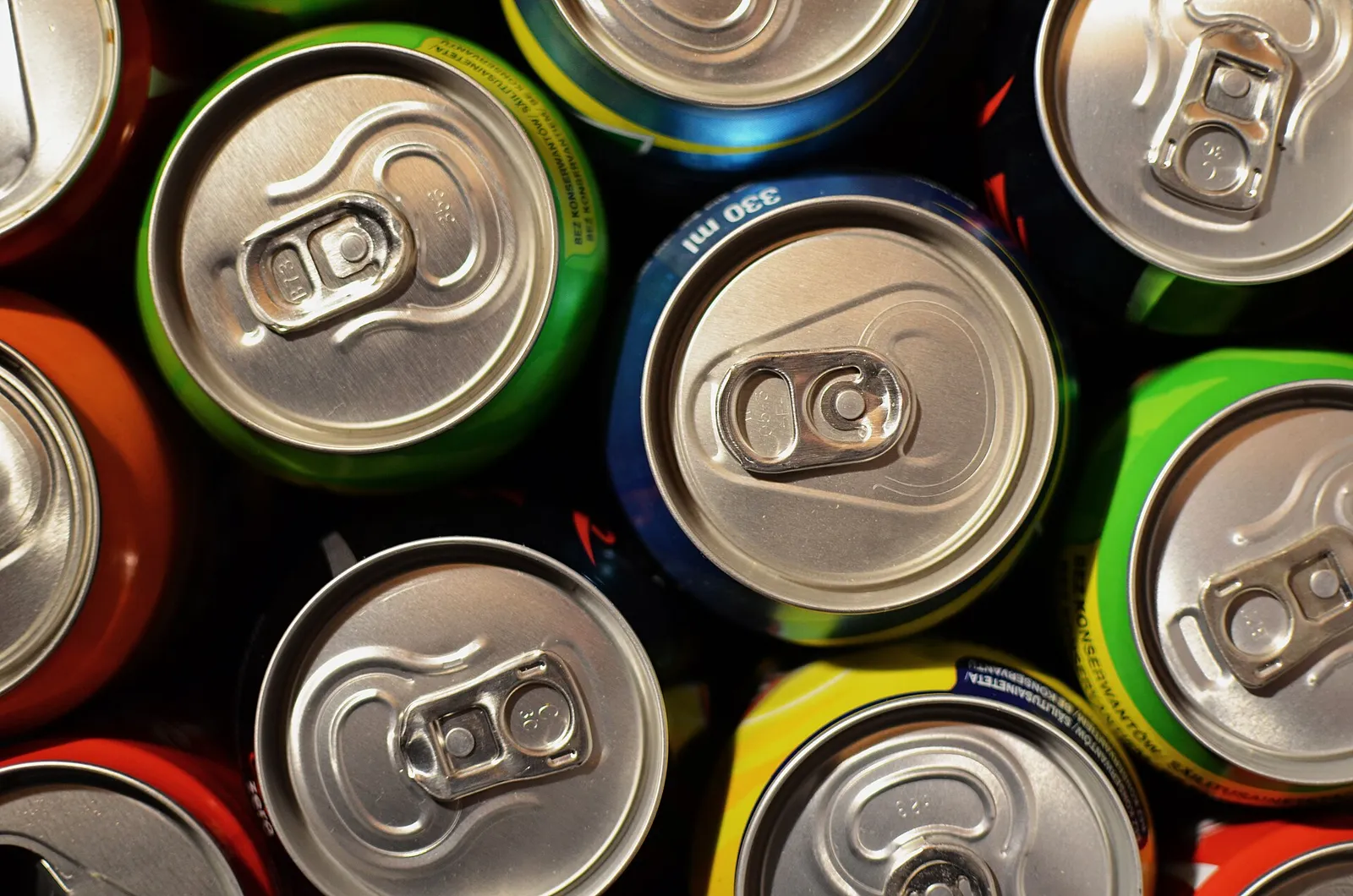 Cans of drinks on a supermarket shelf
