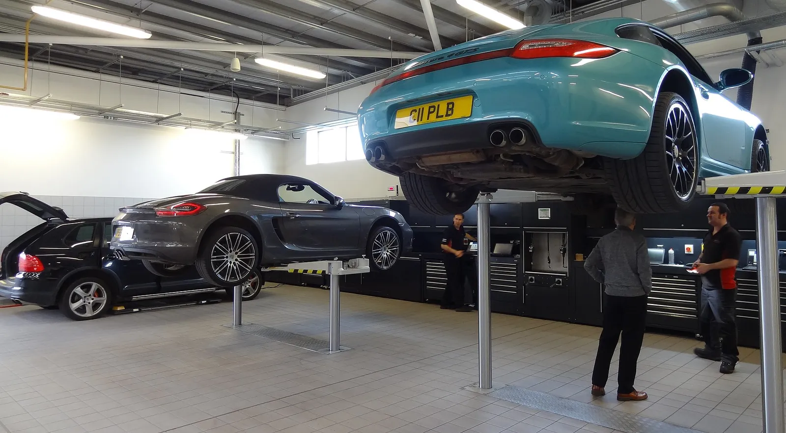 Cars raised on ramps in a repair workshop
