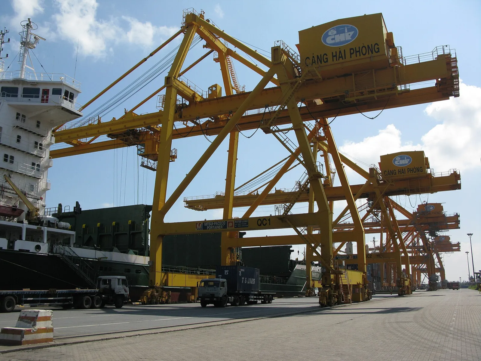 Stacked shipping containers and gantry cranes at the Chua Ve container terminal in the port of Hai Phong, Vietnam
