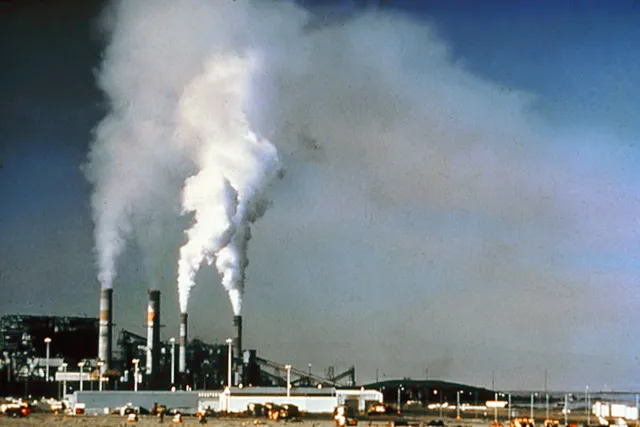 Industrial chimneys emitting air pollution