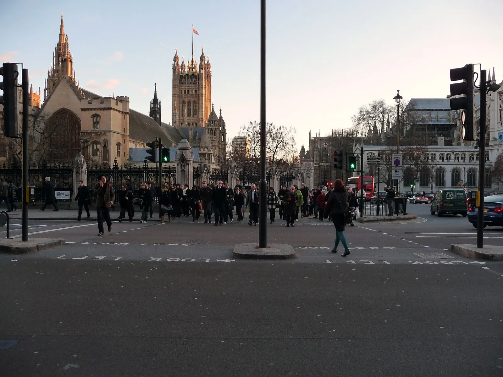 Pedestrians crossing Bridge Street in Westminster, London
