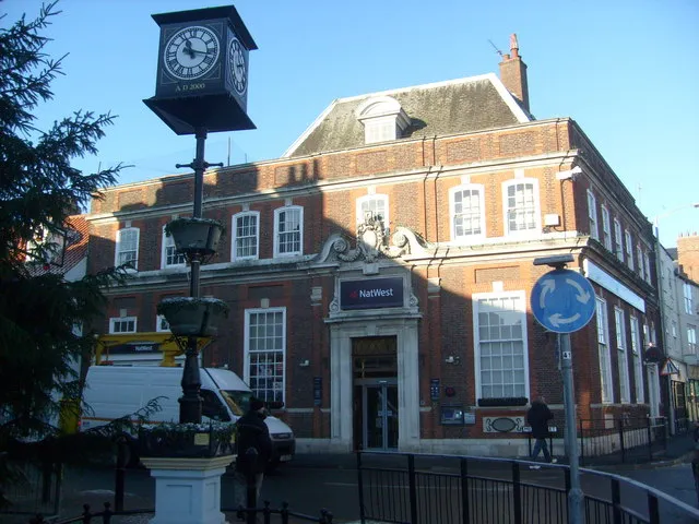 The exterior of a bank building on a street