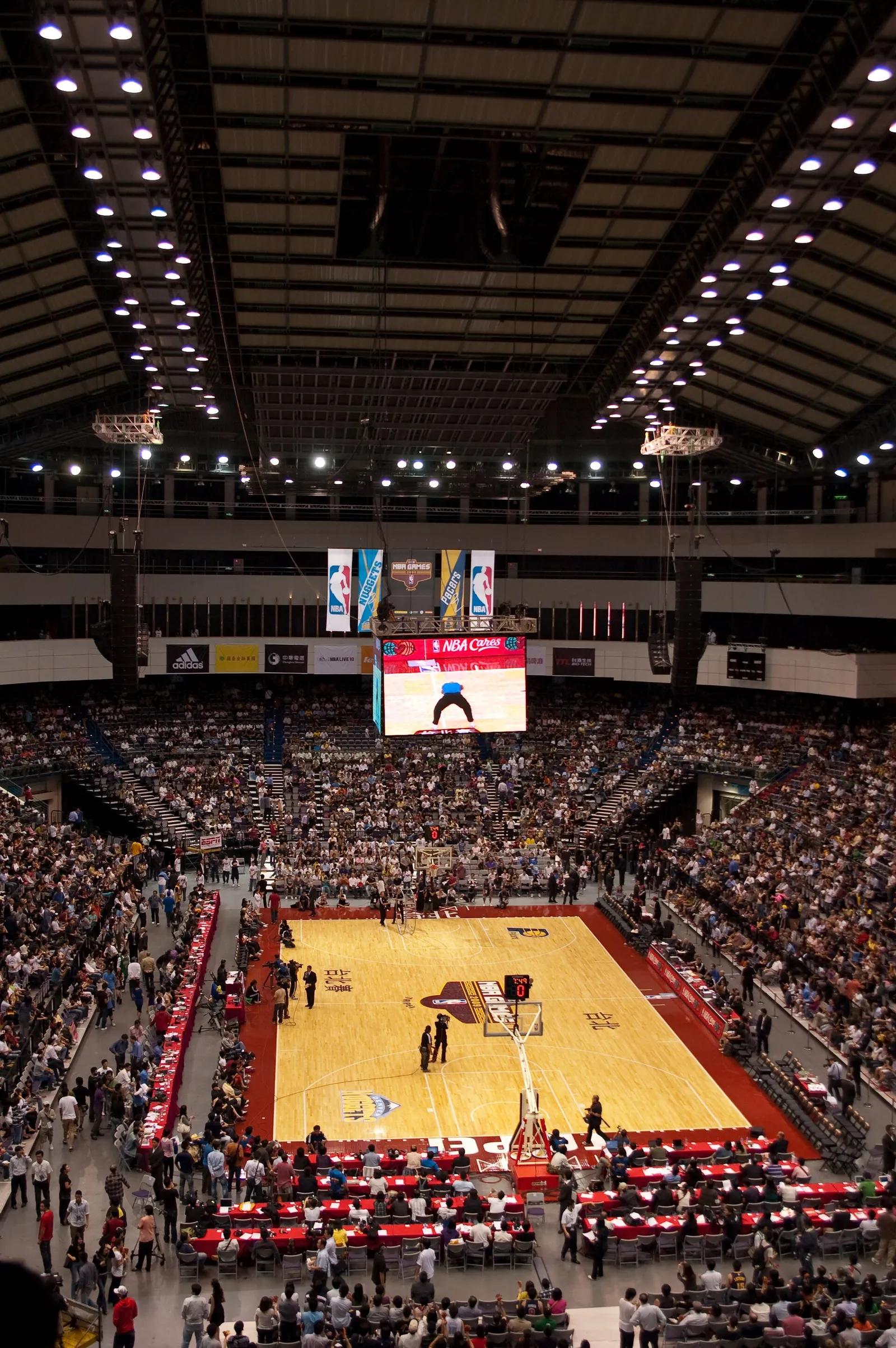 An NBA basketball game in a packed arena