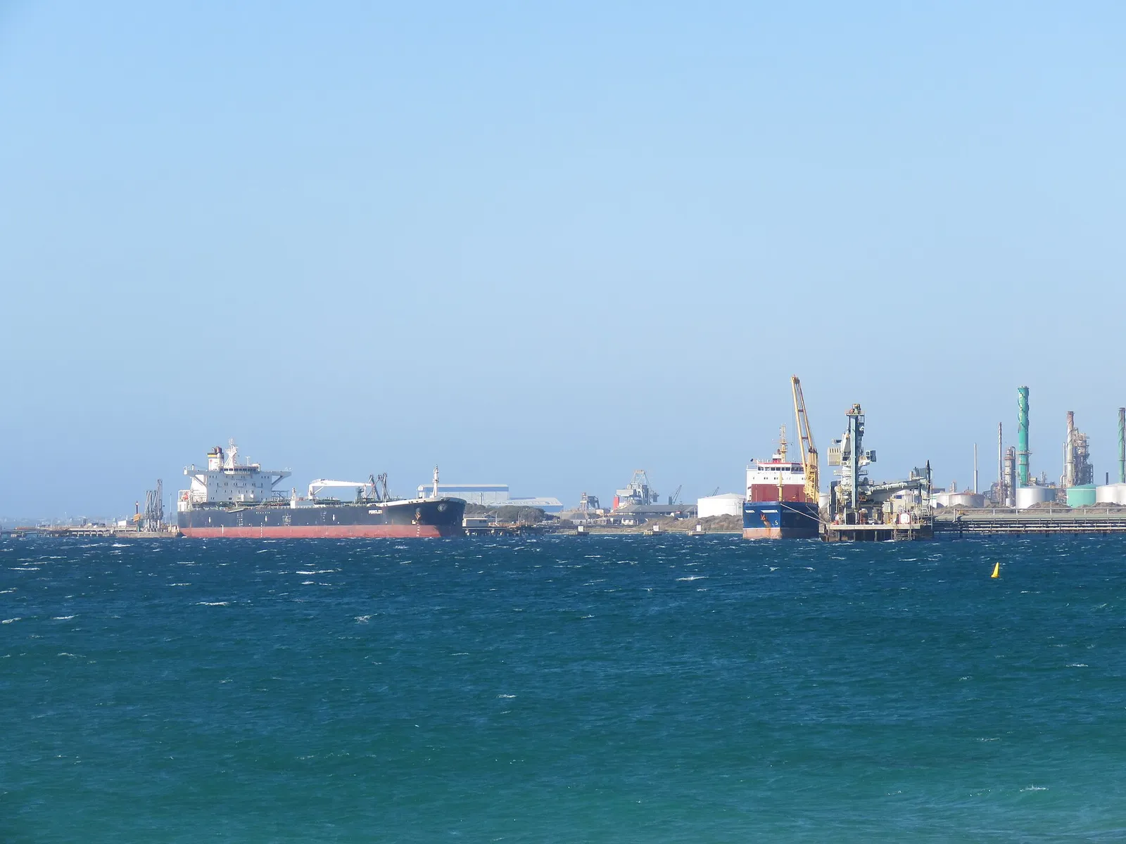 A crude oil tanker at a refinery jetty